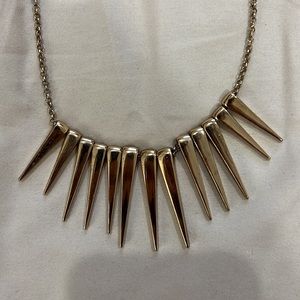 Guess spike gold accent necklace.